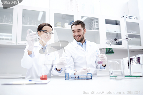 Image of young scientists making test or research in lab