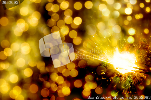 Image of bokeh christmas lights and sparkler