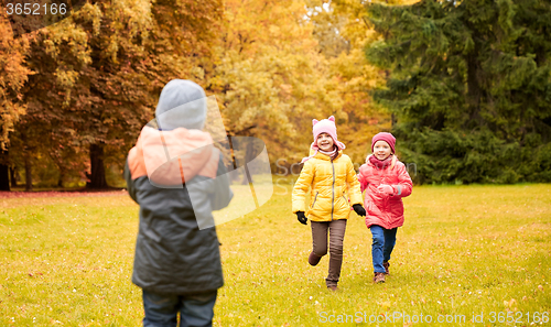 Image of group of happy little kids running outdoors