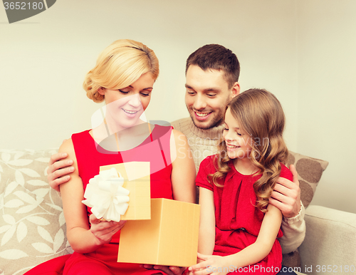 Image of happy family opening gift box