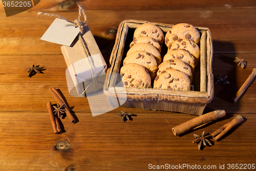 Image of close up of christmas oat cookies on wooden table