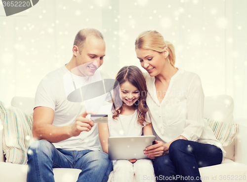 Image of happy family with tablet pc and credit card