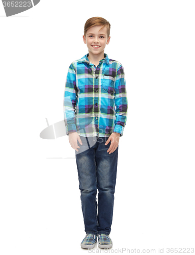 Image of smiling boy in checkered shirt and jeans