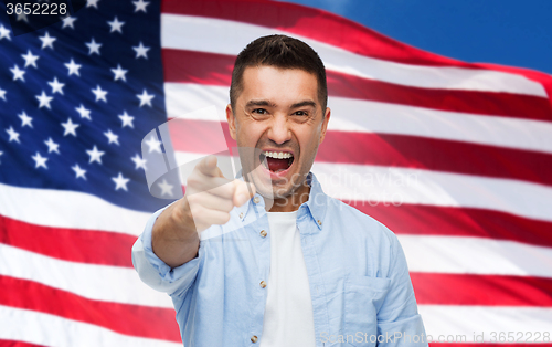 Image of angry man pointing on you over american flag