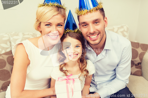 Image of happy family with gift box