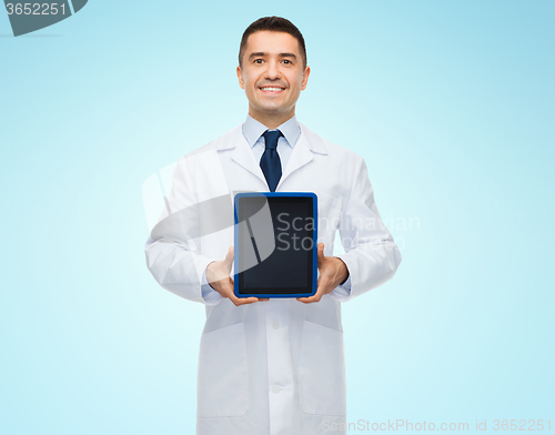 Image of smiling male doctor with tablet pc