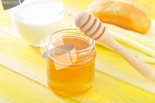 Image of honey,bread and milk