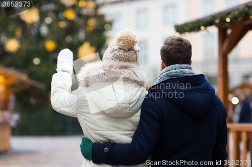 Image of close up of couple in old town at christmas