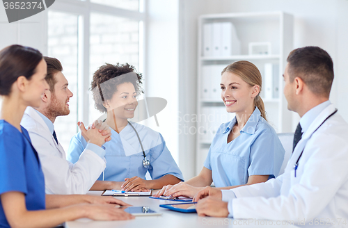 Image of group of happy doctors meeting at hospital office