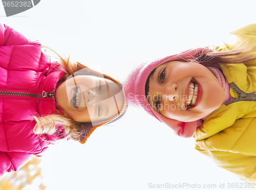 Image of happy girls faces outdoors