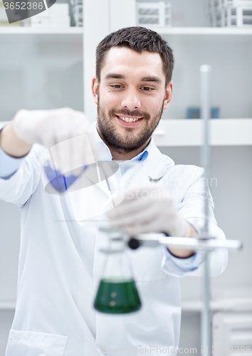 Image of young scientist making test or research in lab