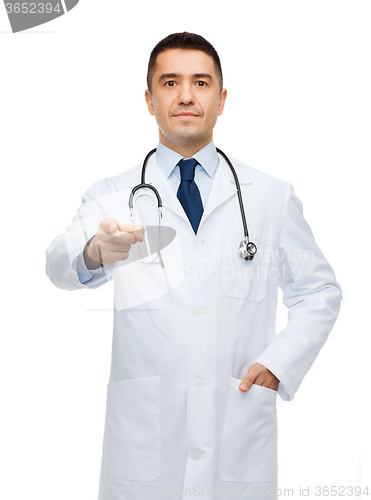 Image of male doctor in white coat pointing at you