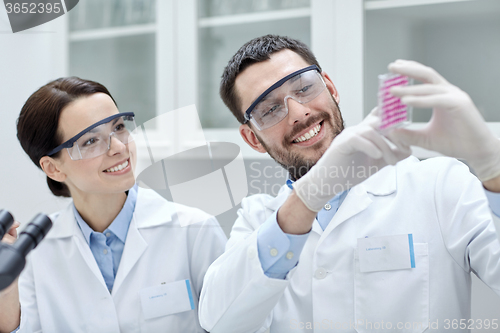 Image of young scientists making test or research in lab