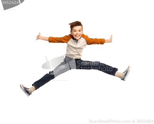 Image of happy smiling boy jumping in air