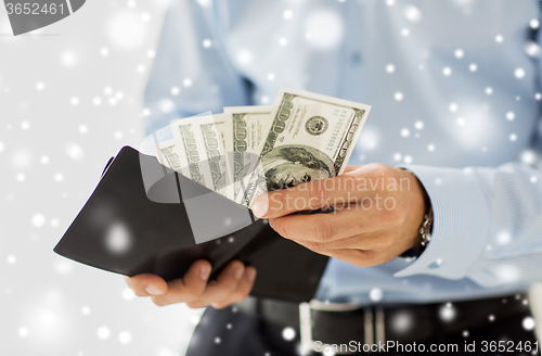 Image of close up of businessman hands holding money