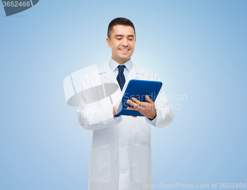 Image of smiling male doctor in white coat with tablet pc