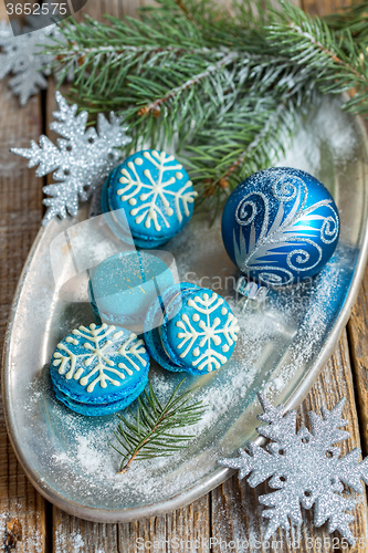 Image of Macarons and Christmas ball. Christmas composition.