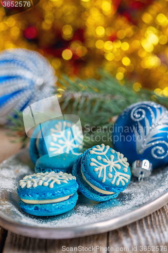 Image of Blue macarons with Christmas decor.