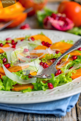 Image of Salad with persimmon and cheese.