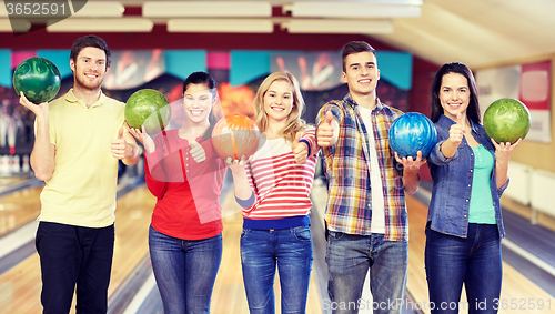 Image of happy friends in bowling club