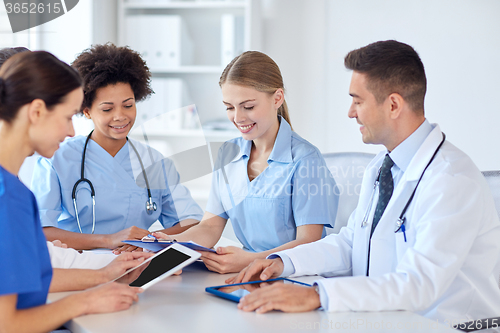 Image of group of happy doctors meeting at hospital office
