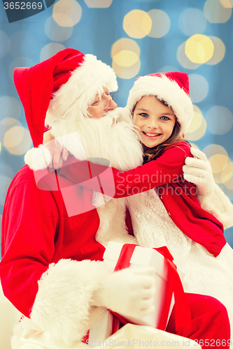 Image of smiling little girl with santa claus