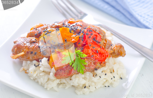 Image of boiled rice with meat and vegetables