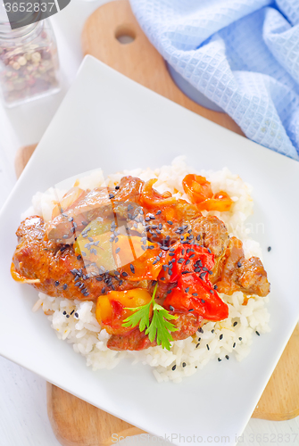 Image of boiled rice with meat and vegetables