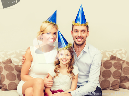 Image of happy family in hats celebrating