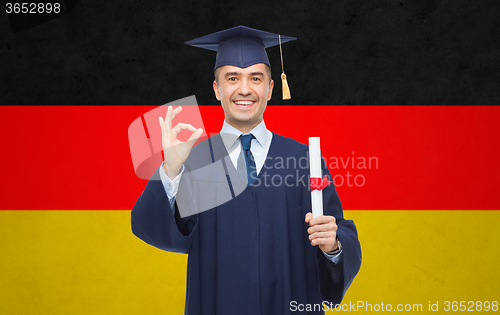 Image of smiling adult student in mortarboard with diploma