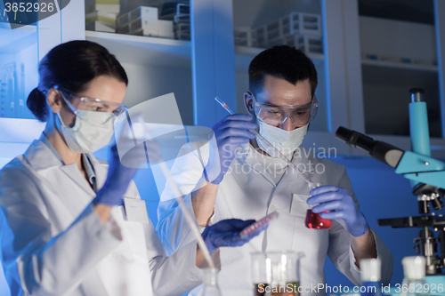 Image of close up of scientists making test in lab