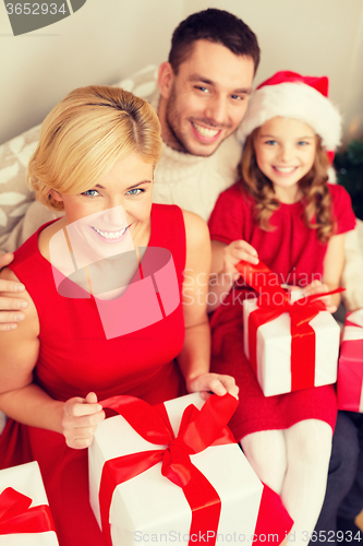 Image of happy family opening gift boxes