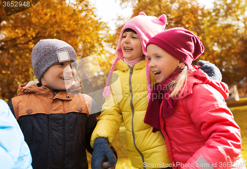 Image of group of happy children in autumn park