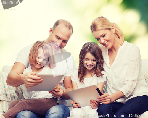 Image of happy family with tablet pc computers