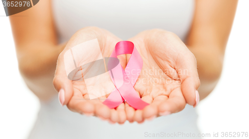 Image of hands holding pink breast cancer awareness ribbon