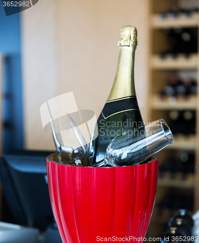 Image of close up of champagne and glasses at restaurant