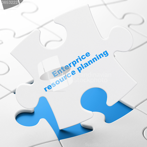 Image of Finance concept: Enterprice Resource Planning on puzzle background