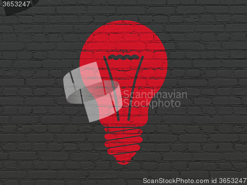 Image of Finance concept: Light Bulb on wall background