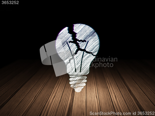 Image of Finance concept: Light Bulb in grunge dark room