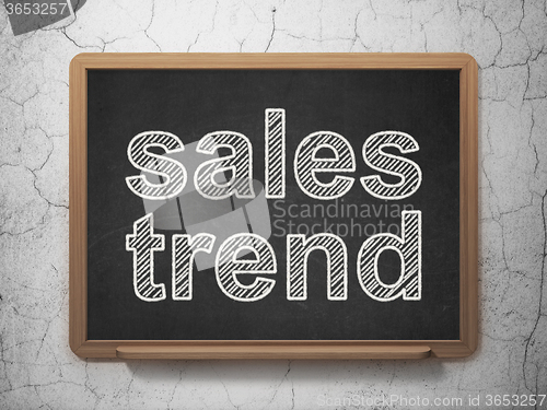 Image of Advertising concept: Sales Trend on chalkboard background