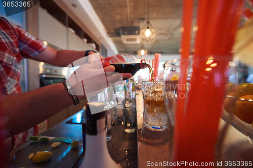 Image of barman prepare fresh coctail drink