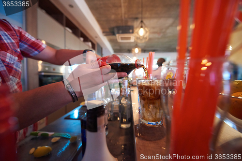 Image of barman prepare fresh coctail drink