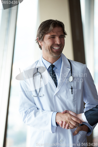 Image of doctor handshake with a patient