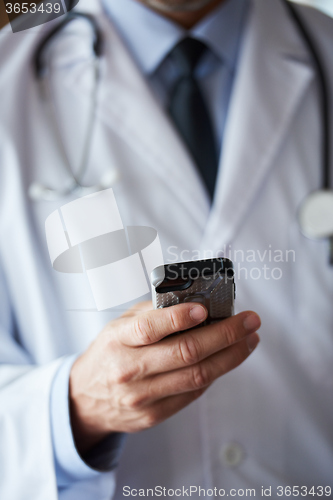 Image of doctor speaking on cellphone