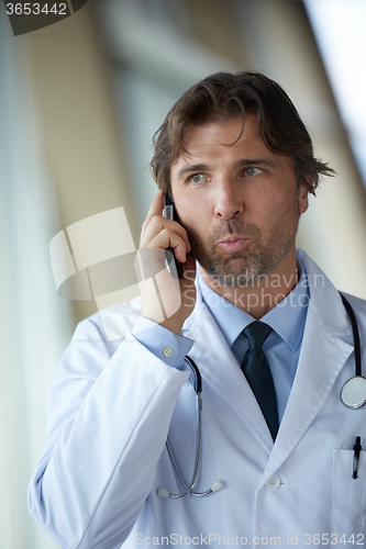 Image of doctor speaking on cellphone