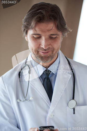 Image of doctor speaking on cellphone