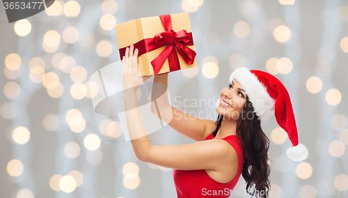 Image of beautiful sexy woman in santa hat with gift box