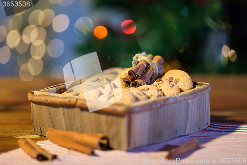 Image of close up of christmas oat cookies on wooden table