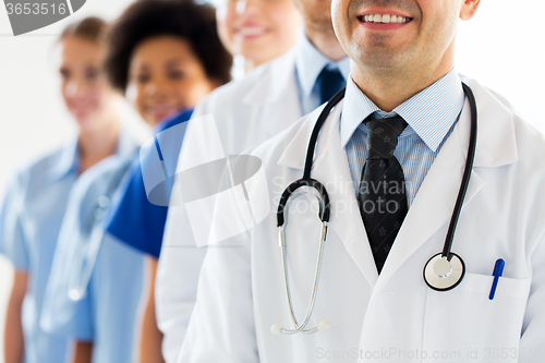 Image of close up of happy doctors with stethoscope