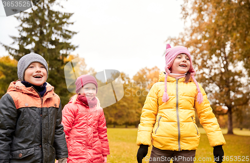 Image of group of happy children in autumn park